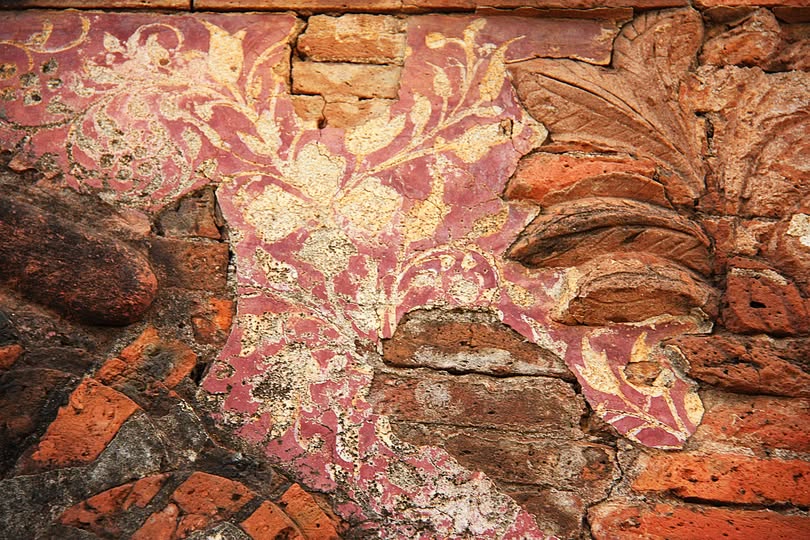 Exposed masonry beneath painted panels