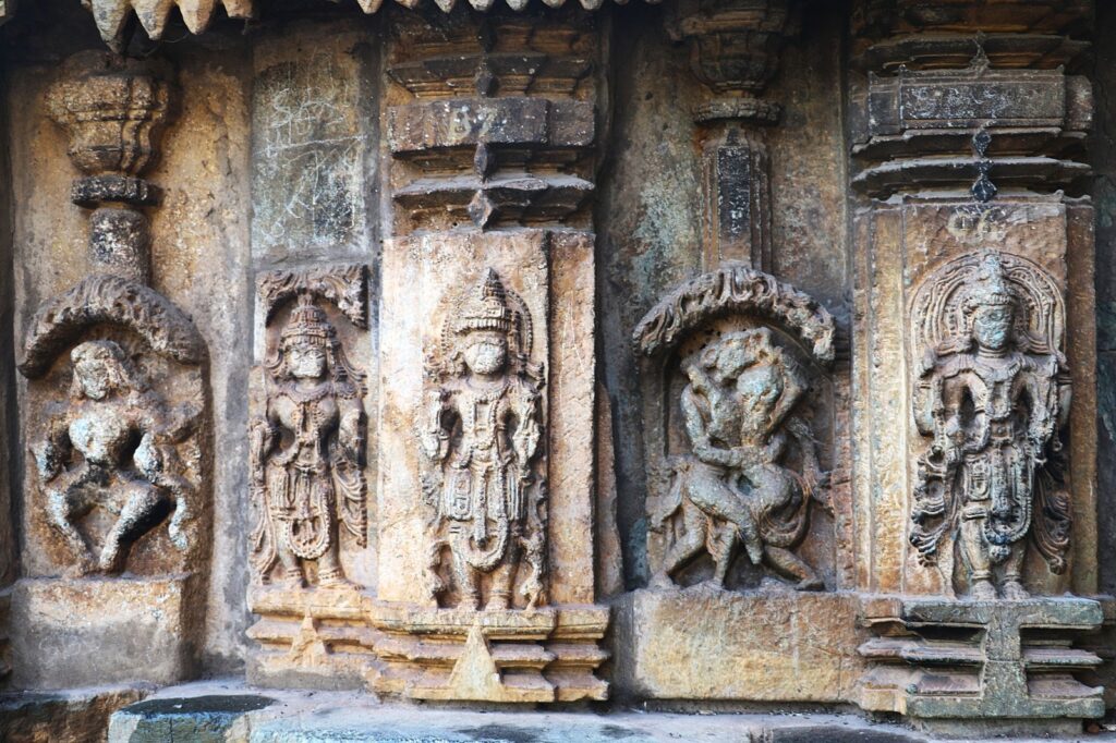 Image of divine figures on Facade of Lakshmi Narasimha Temple by Indrani