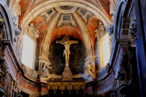 Observe carefully to see the muscular Jesus made of wood.