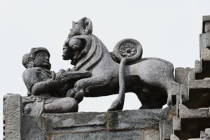 Mythical founder, Sala, stabbing a lion-like creature with a dagger - Emblem of Hoysala Empire