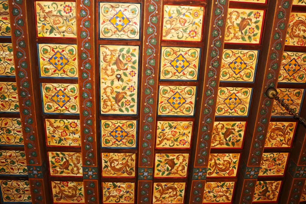 polychrome painting to embellish wooden panels - hallmark of the city’s artistic and architectural heritage, reflecting both Moorish-influenced geometric designs and European Renaissance floral patterns