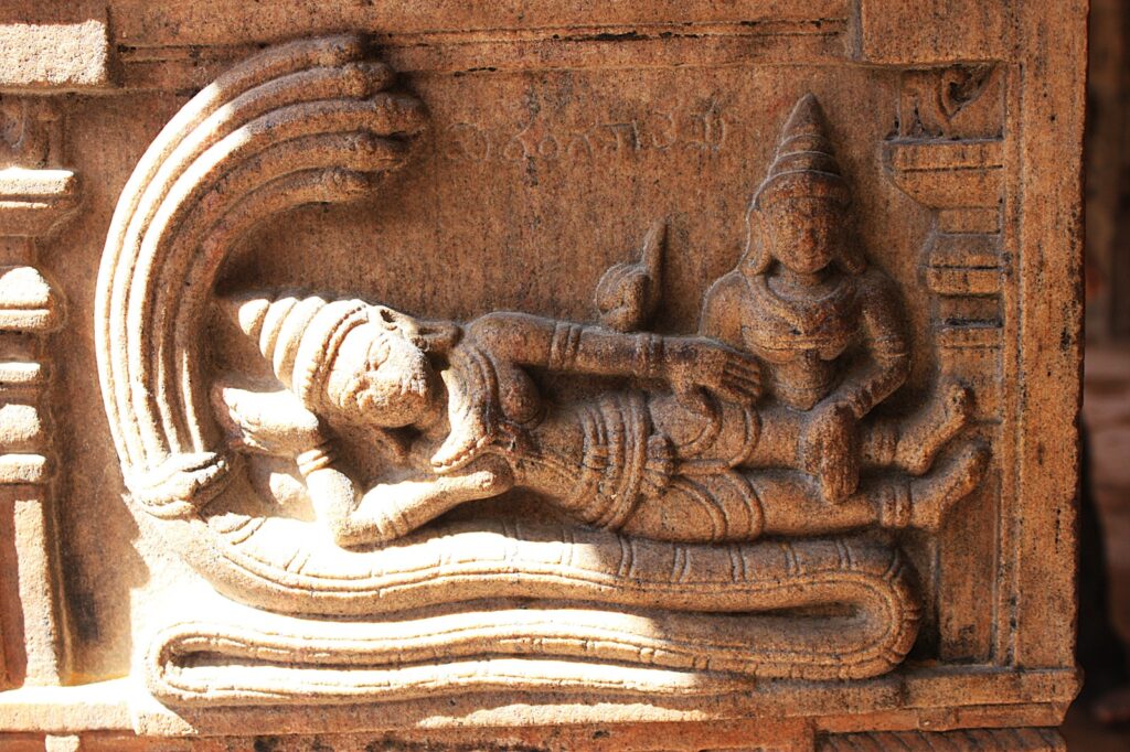 Stone carving of Bhagwan Vishnu with his consort Lakshmi - Melkote Places to visit