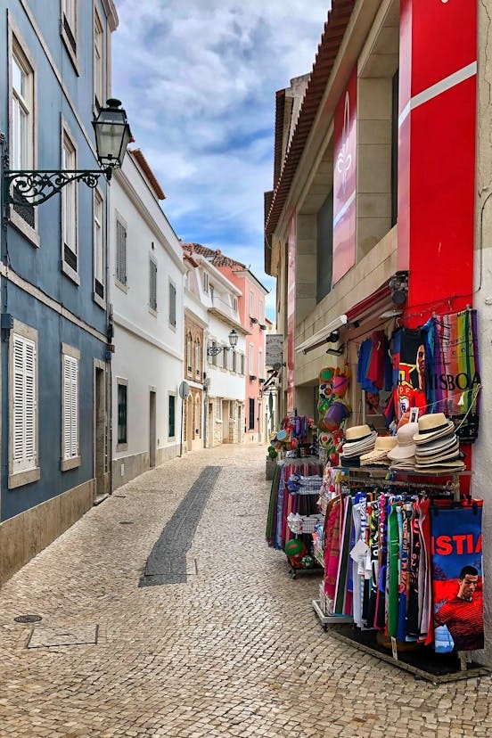 Street Market with Clothes on Empty Alley in Town