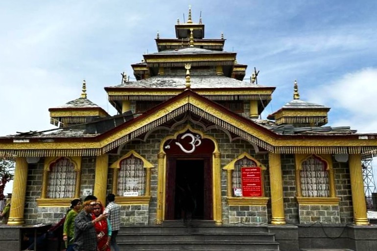 The intricate front facade and entrance architecture of the Surkanda Devi Temple near Mussoorie, captured in April 2026.