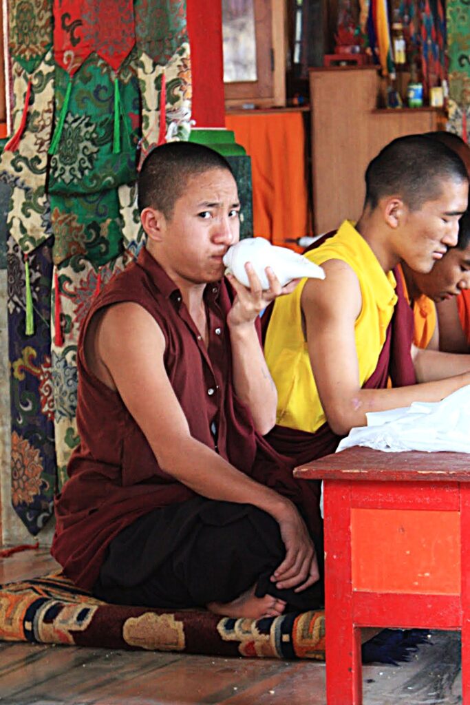 Tibetan Monk blowing Conch