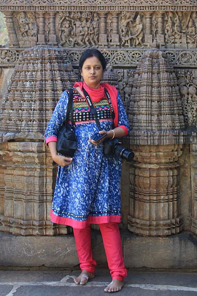 With intricately carved friezes in background